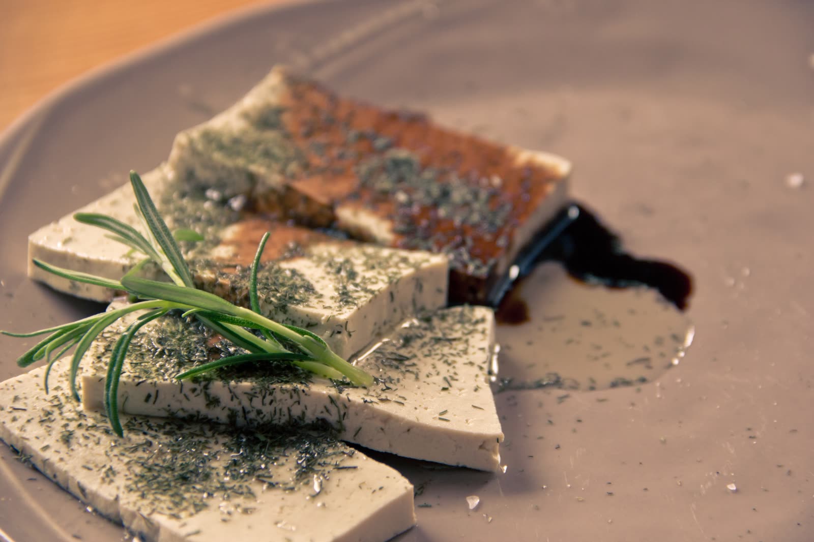 Vegetarian tofu dish served with colorful vegetables.